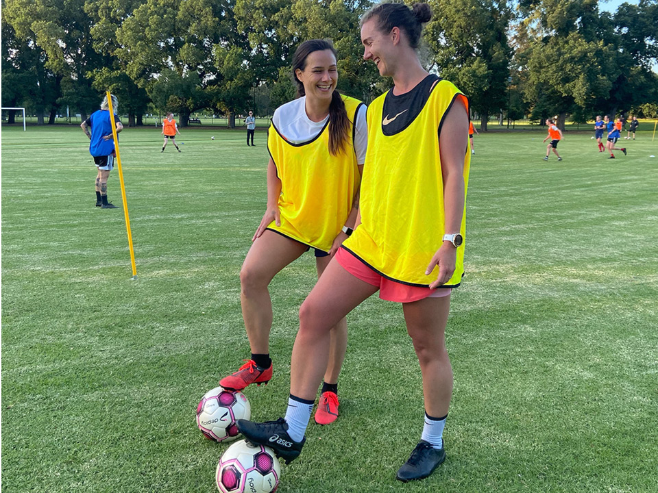 Two south yarra women's players at a training session